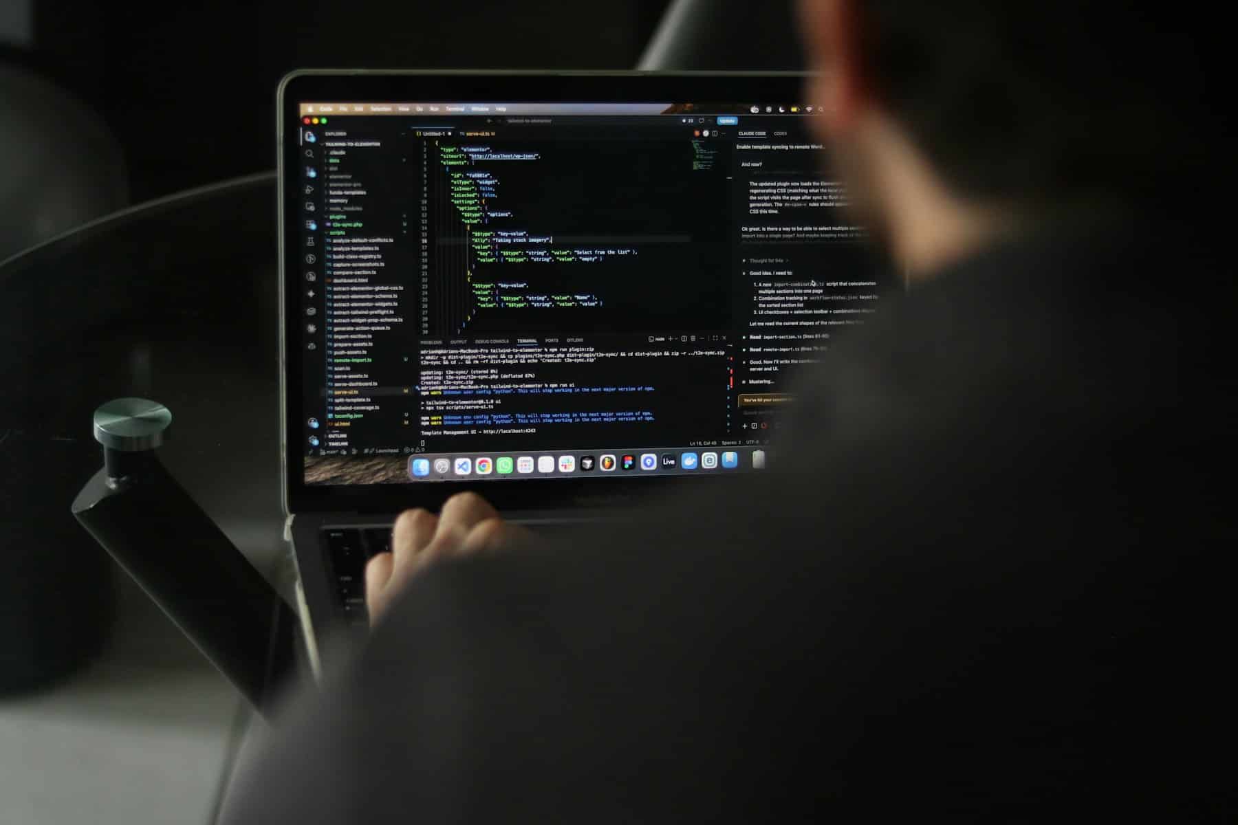 Developer debugging website code on a laptop during WordPress website rescue